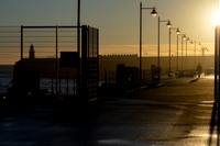 Man walking at sunrise - Harbour Arm - Folkestone